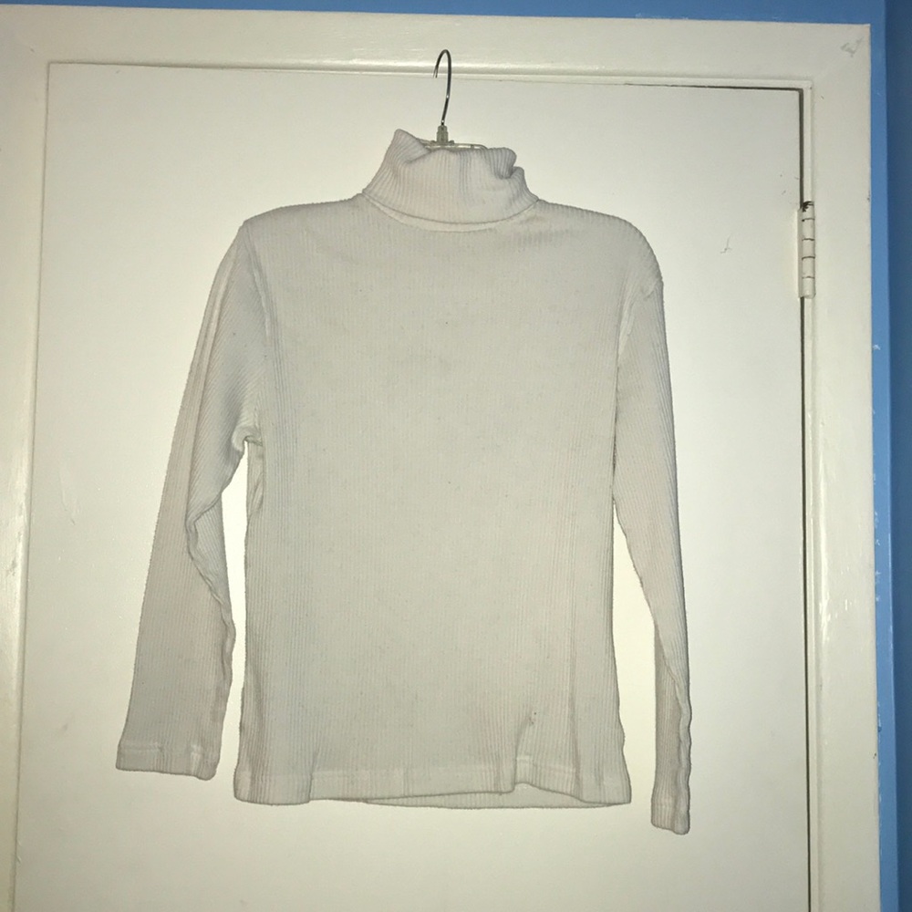 Carolyn Taylor white turtle neck